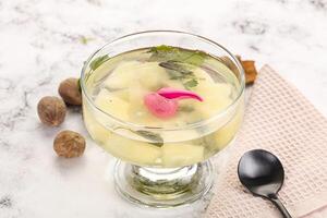 Sweet pineapple jelly with mint photo