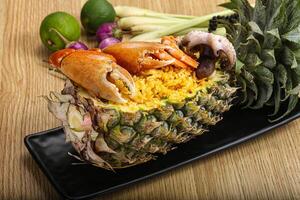 Rice with seafood in pineapple photo