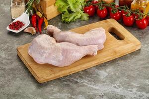 Raw chicken leg foe cooking photo