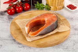 Raw salmon steak for cooking photo