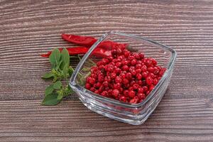 Red pepper seeds in the bowl photo