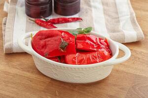 Marinated red bell pepper with oil photo