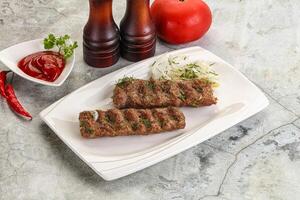 Kebab with beef served onion photo