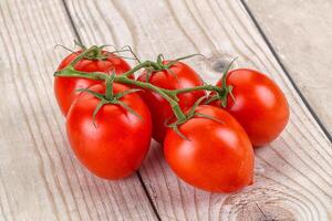 Raw red Flamenco tomato branch photo