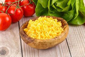 Shredded cheese in the bowl photo