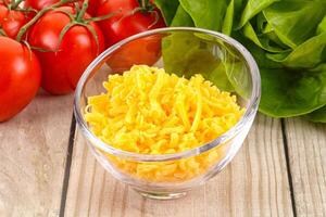 Shredded cheese in the bowl photo