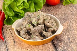 Chicken liver with cream sauce photo
