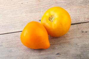 Ripe yellow bright juicy tomato photo