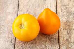 Ripe yellow bright juicy tomato photo