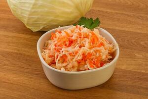 Sauerkraut - pickled cabbage in the bowl photo