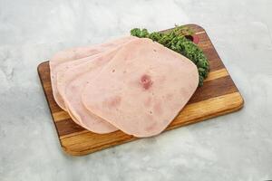 Sliced Pork Ham over board photo