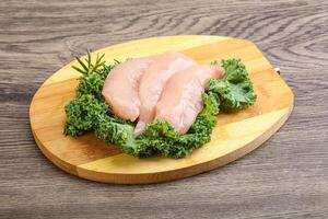 Raw small chicken fillet for cooking photo