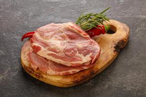 Raw pork meat neck steak photo