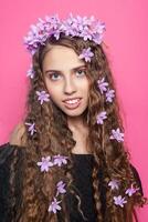 Beautiful girl with flowers in in hair photo