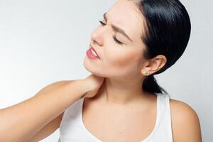 Tired Neck. Beautiful Young Woman Suffering From Neck Pain photo