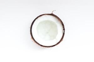 Half of coconut closeup on a white background photo