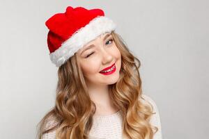 Beautiful female model wear santa hat photo