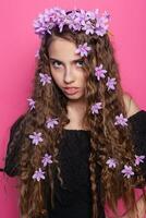 Beautiful girl with flowers in in hair photo