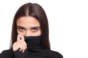 Confident female wearing black turtleneck sweater while posing photo