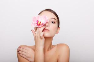 Beautiful Girl With Orchid Flowers photo