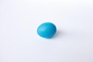 Blue easter egg isolated on white background photo