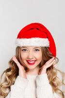 Beautiful female model wear santa hat photo