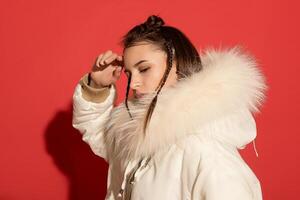 girl white jacket poses red background photo