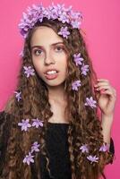 Beautiful girl with flowers in in hair photo