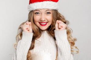 Beautiful female model wear santa hat photo