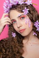 Beautiful girl with flowers in in hair photo