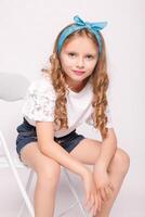 Cute little girl in white t-shirt. Mock-up. photo