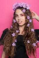 Beautiful girl with flowers in in hair photo