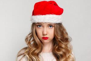 Beautiful female model wear santa hat photo