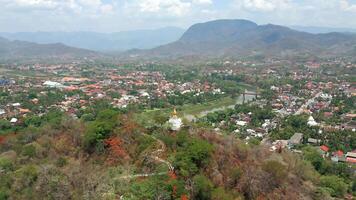 Aerial view of the Buddhist temple on the hill in the city of Luang Prabang, Lao video