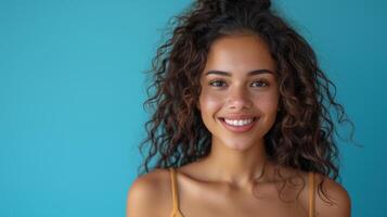 AI Generated Isolated young latin woman using laptop device on blue background. Smiling woman holding computer presenting advertising shopping or job search website. photo