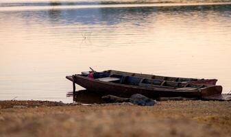 Old Fishing Boat Drifting on River photo