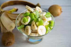 fruit salad of bananas and kiwi photo