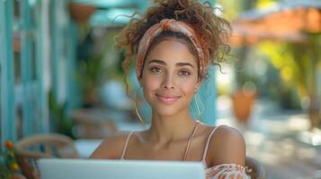 AI Generated A smiling latin woman using a laptop on a blue background, typing, surfing, searching for a job online or looking at shopping websites. photo