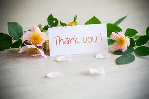 beautiful pink small roses on a wooden table. photo