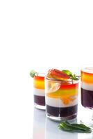 lot of colored sweet fruit jelly in a glass photo