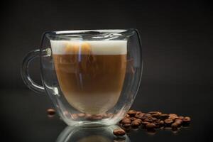 hot coffee with milk on black background photo