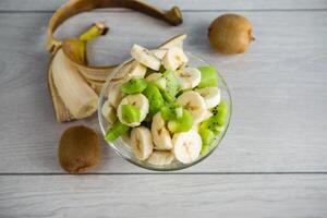 fruit salad of bananas and kiwi photo