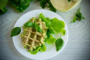 vegetable waffles cooked with herbs in a plate photo