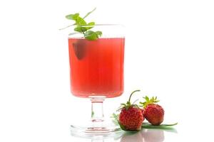 Cold summer strawberry kvass with mint in a glass photo