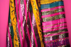 AI generated Kente Glamour Bright Colors and Dazzling Pink Glitter Illuminate the Cloth photo