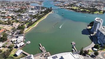 boats on river in city rockingham aerial 4k video