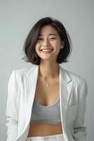 AI generated a confident young lady wearing white blazer smiling lively in isolated plain studio background photo