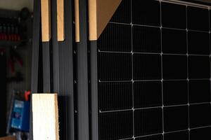 Solar panels on a well-exposed wall of an individual house, making savings following the energy crisis, eco-citizen gesture, green energy photo