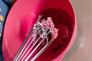 Child having fun modeling salt dough, authentic activity with natural pink coloring beet juice, fine motor skills development photo