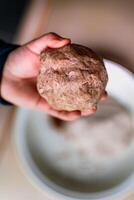 Child having fun modeling salt dough, authentic activity, fine motor skills development photo
